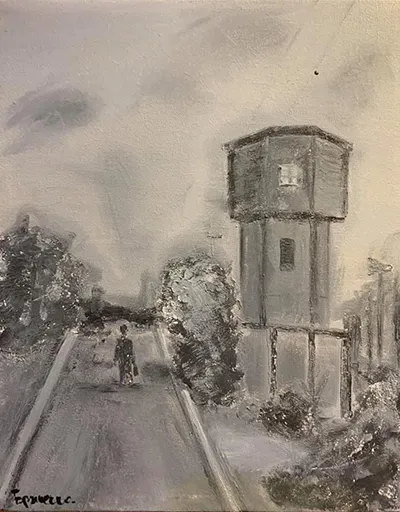 Чоловік йде повз водонапірну башту